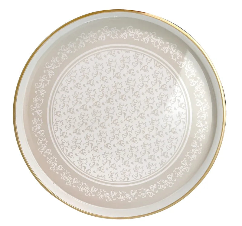 Bandeja decorativa redonda Riccioli Di Fata de Brandani, con diseño de rizos y borde elevado, sobre fondo claro.