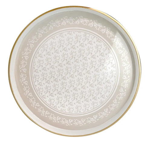 Bandeja decorativa redonda Riccioli Di Fata de Brandani, con diseño de rizos y borde elevado, sobre fondo claro.