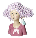 Busto decorativo de resina con la figura de una mujer y un pájaro posado, acabado mate.