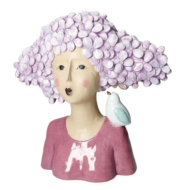 Busto decorativo de resina con la figura de una mujer y un pájaro posado, acabado mate.