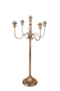 Candelabro de 5 brazos en color neutro, con dimensiones 34 x 34 x 75 cm.