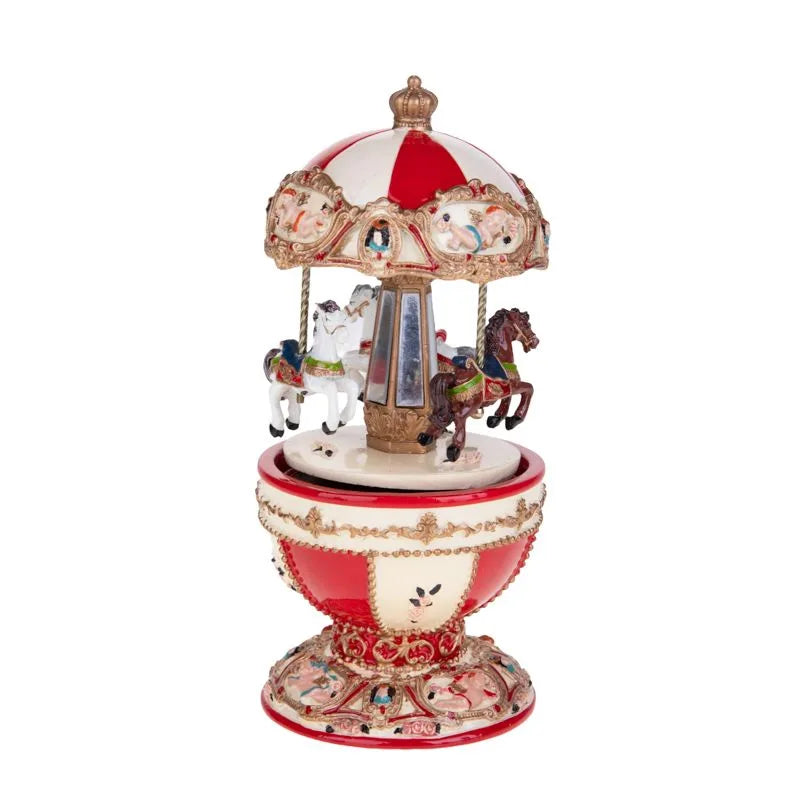 Carrillón navideño con forma de caballitos, en movimiento y emitiendo música, con una altura de 18.5 cm.