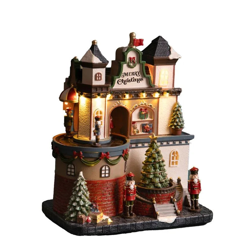 Castillo navideño decorativo con luces LED, música y movimiento en primer plano.
