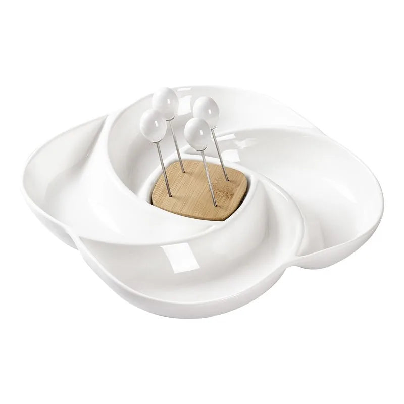 Centro de mesa Girella de Brandani en porcelana blanca y bambú, con cuatro pequeños tenedores a juego sobre la superficie.