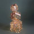 Columna decorativa navideña en forma de paquete de regalo, adornada con 350 luces LED.