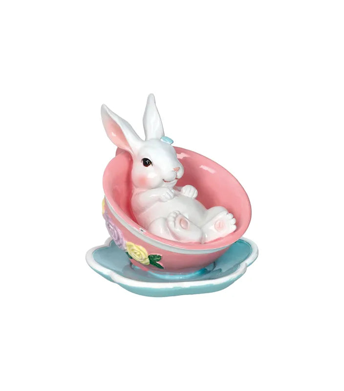 Figura decorativa de una conejita en pose relajada, marca Brandani, con dimensiones 11 x 11 x 12 cm.