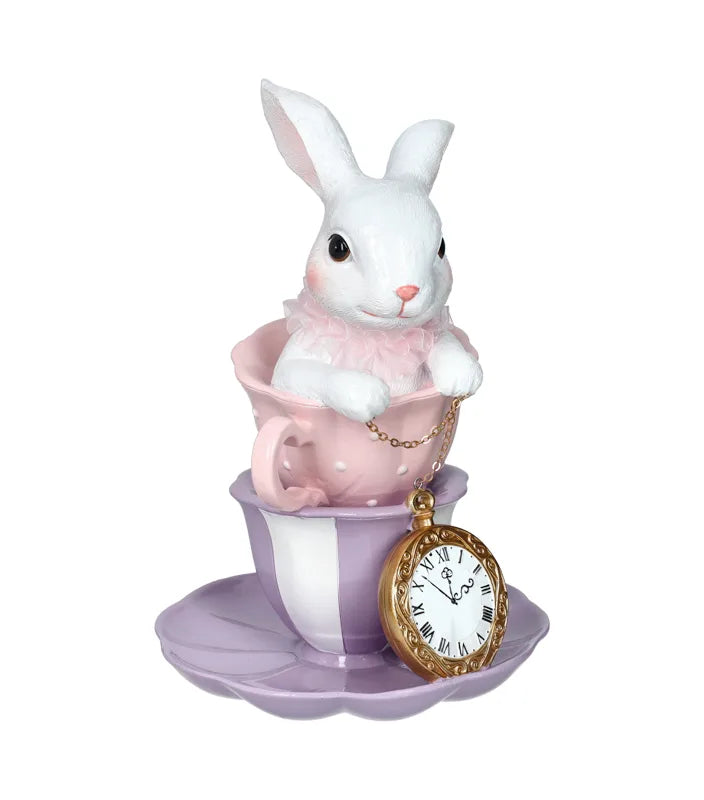 Conejo blanco decorativo de cerámica, 17 cm de ancho por 25 cm de alto, con acabado liso y detalles sutiles.