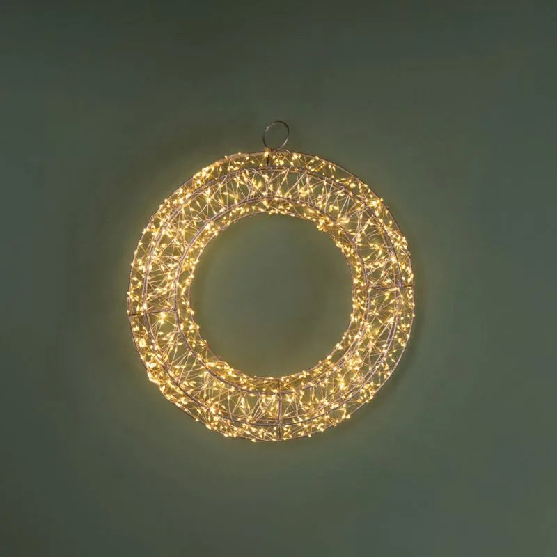 Guirnalda navideña de 40 cm con 960 luces LED de tono cálido, dispuestas en un diseño circular.