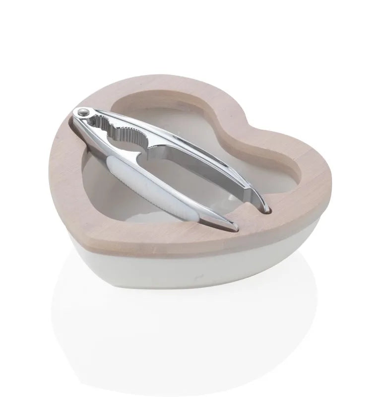 Cuenco decorativo en forma de corazón, fabricado en porcelana blanca y con base de bambú natural.