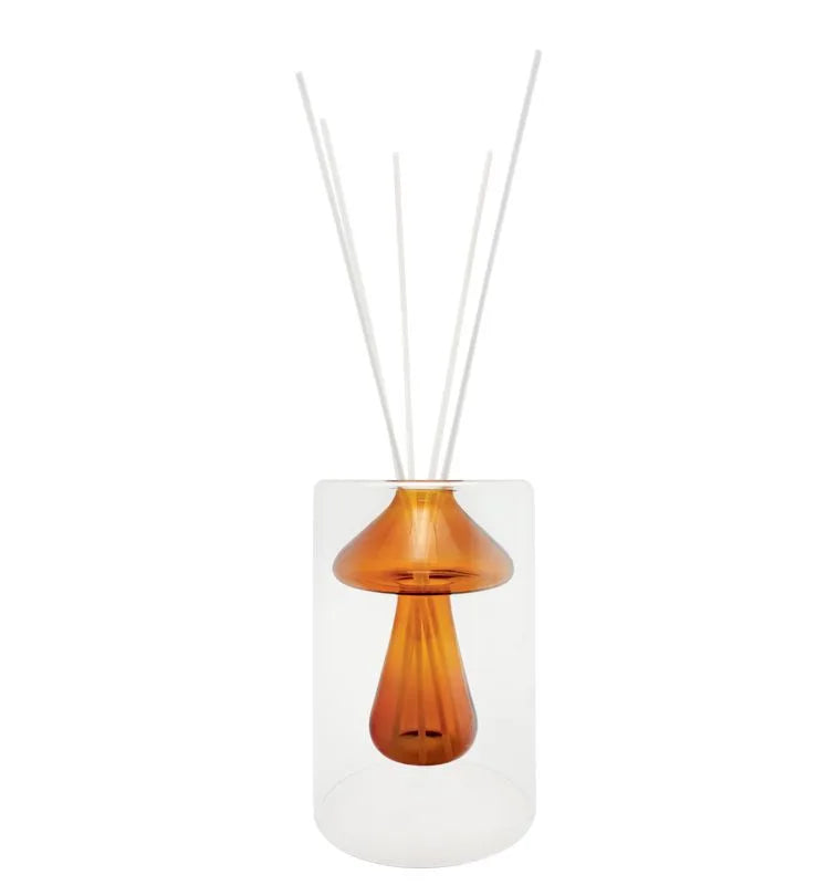 Difusor de fragancia con forma de hongo en color naranja, con detalles de diseño italiano.