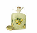 Difusor de fragancia Limoni en porcelana blanca con detalles amarillos, presentado en su empaque.