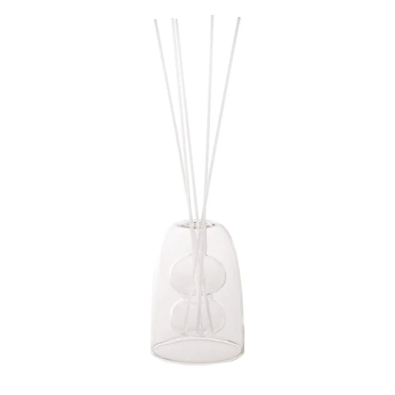 Mini difusor de fragancia transparente con forma de ampolla, ideal para decorar y perfumar el hogar.