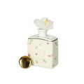 Difusor de fragancia Pollini amarillo en porcelana, presentado sobre un fondo neutro.