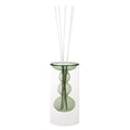 Difusor de fragancia Silhouette en color verde, con base y varillas decorativas.