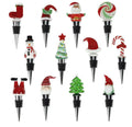Display de 12 tapones para botellas con motivos navideños de la colección Christmas.