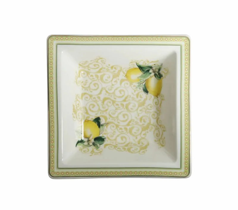 Fuente cuadrada pequeña Limoni de porcelana blanca con diseño de limones amarillos y verdes.