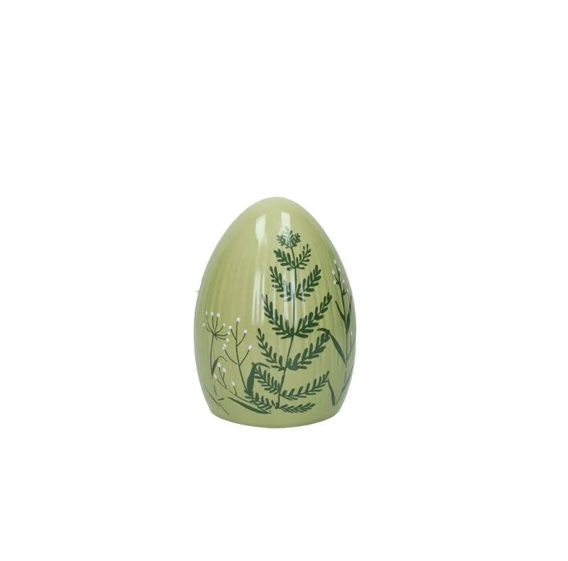 Huevo de Pascua decorativo de color verde intenso, con base y forma ovalada.