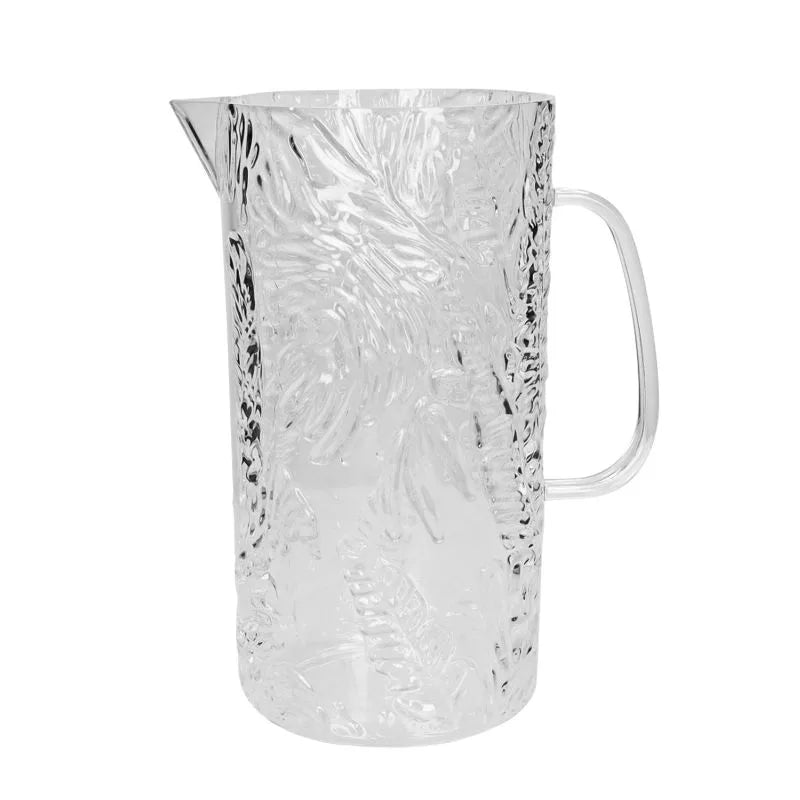 Jarra de acrílico transparente con diseño tropical en la tapa y cuerpo.