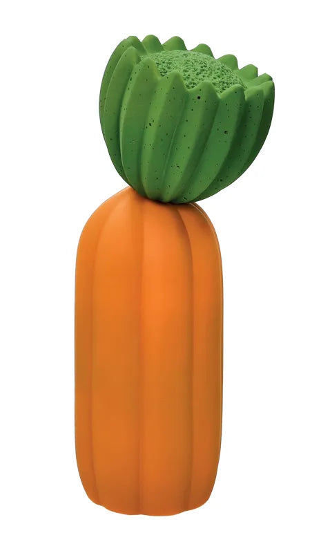 Lámpara decorativa con forma de cactus naranja y flor verde, de pie sobre una superficie.