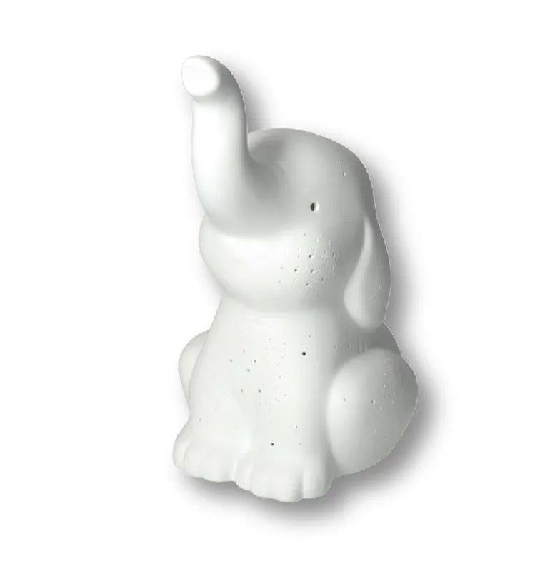 Lámpara de mesa con forma de elefante en porcelana blanca, con cable y enchufe.