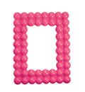 Marco de fotos rectangular de color rosa fluorescente, con el nombre 'LOLLIPOP' en la parte inferior.