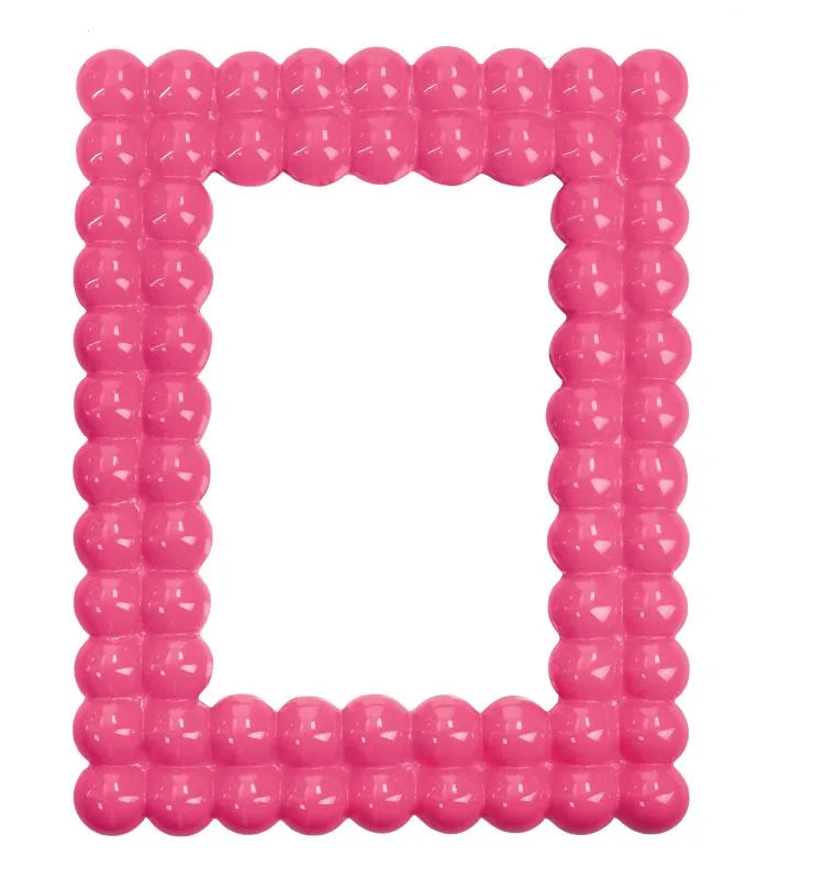 Marco de fotos Brandani Gift Group modelo Lollipop Pink Fluo para fotografía de 13x18 cm con acabado rosa flúor.