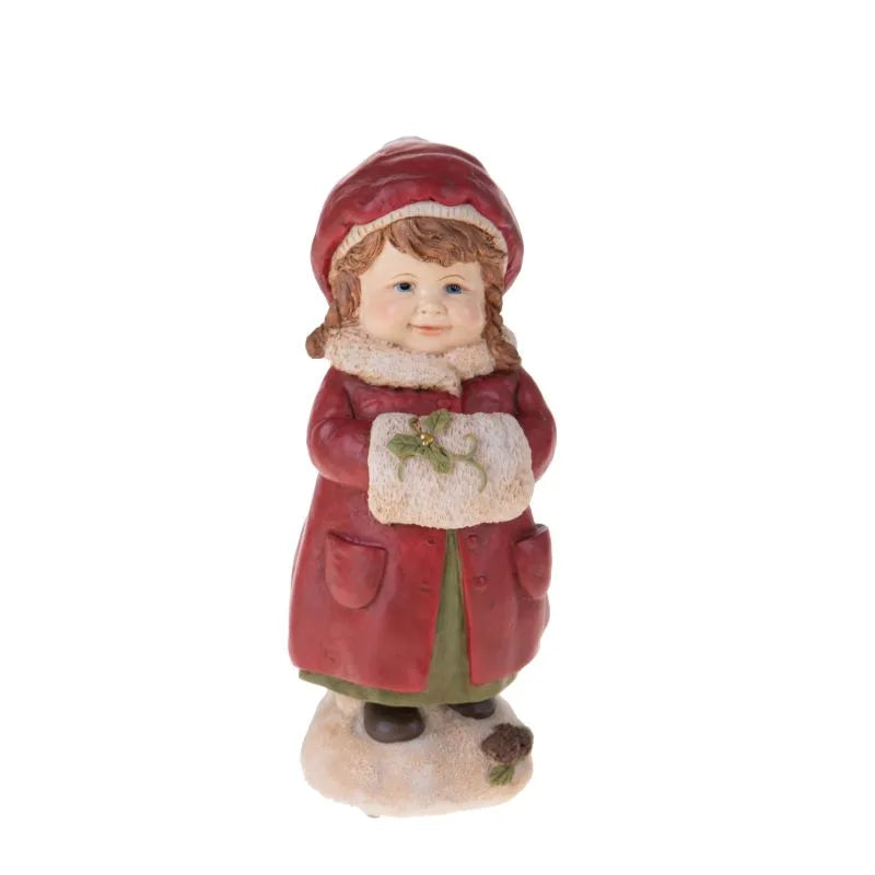 Figura decorativa 'Niña con Calientamanos' de la colección Natale, con detalles cuidados.