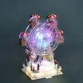 Noria Panorámica Navideña con 3 luces LED y base decorativa, dimensiones 20 x 14 x 28 cm.