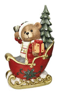 Figura decorativa de un oso tierno durmiendo en una cuna, con un diseño clásico navideño de Brandani.