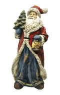 Figura de Papá Noel sonriente con una lámpara en la mano, de cerámica blanca, diseño Brandani.