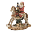 Figura de Papá Noel sentado en un caballito balancín, con detalles navideños, estilo Brandani.