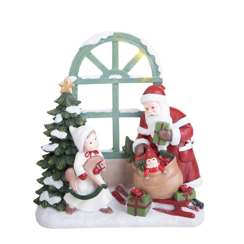 Figura decorativa de Papá Noel Brandani asomándose por una ventana, con detalles festivos.