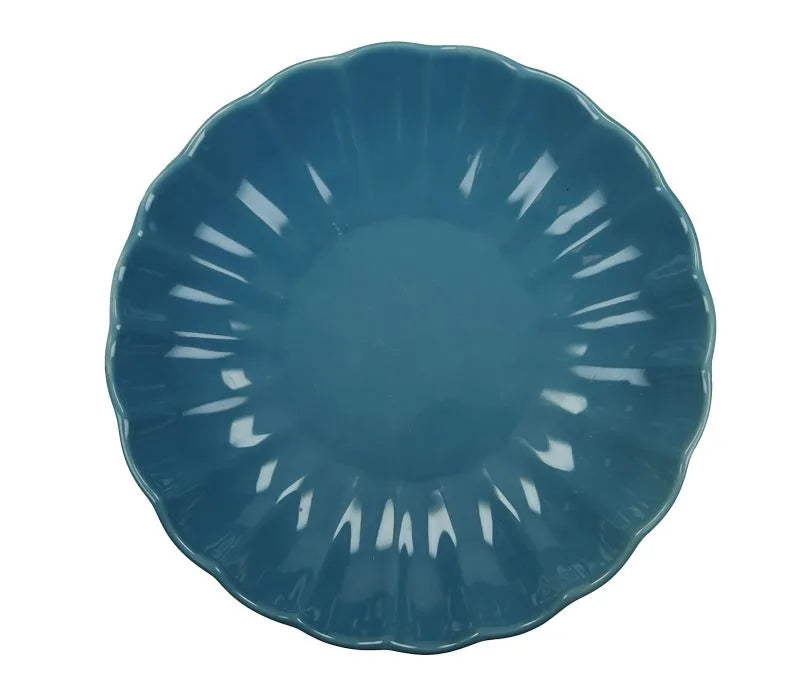 Plato hondo azul de la colección Calipso, con un diseño moderno y acabado liso.