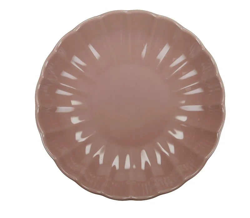 Plato hondo de cerámica rosa de la colección Calipso, con un diseño moderno y acabado liso.