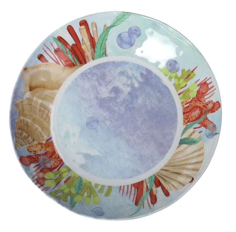 Plato hondo de melamina de la colección Oceano, con un diseño que evoca las olas del mar en tonos azules y blancos.