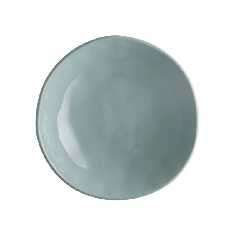 Plato hondo de gres en color agua, colección Sinfonia, con un diseño moderno italiano.