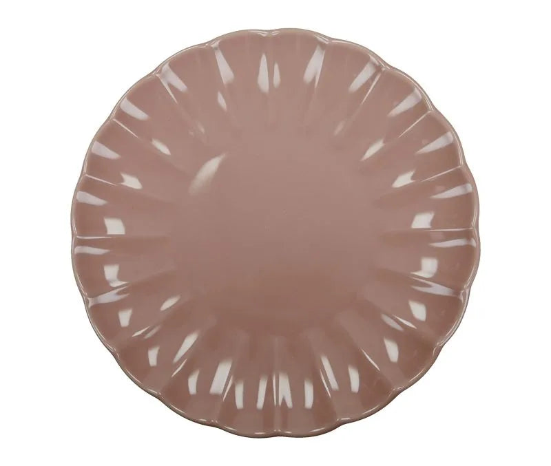 Plato llano de cerámica rosa, colección Calipso, con borde sutilmente elevado y acabado liso. Diseño italiano.