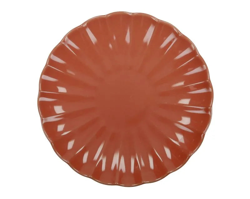 Plato de postre redondo de cerámica en color coral, perteneciente a la colección Calipso de Brandani.