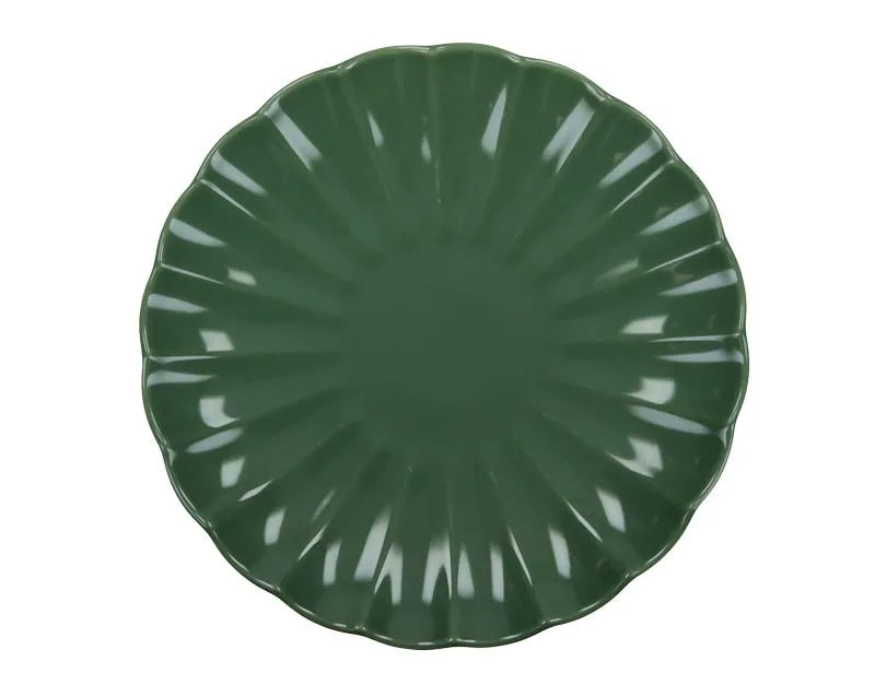 Plato de postre Calipso Menta, pieza de cerámica con borde ligeramente ondulado y acabado liso en color verde menta.