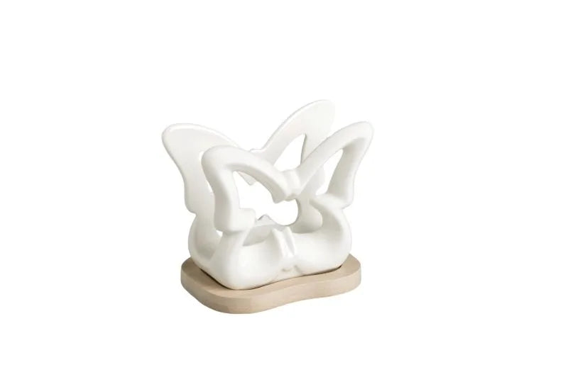 Servilletero Mariposa fabricado en porcelana blanca con base de bambú natural.