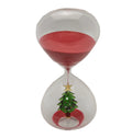 Reloj de arena decorativo con forma de árbol de Navidad, color rojo y blanco, sobre un fondo neutro.
