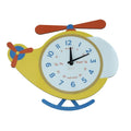Reloj de sobremesa con forma de helicóptero y péndulo, acabado en tonos neutros, de Brandani.