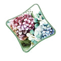 Salvamanteles Flora de Brandani, fabricado en cerámica y corcho, con un diseño floral.