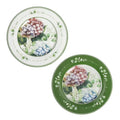Set de 2 platos de postre redondos de porcelana blanca con borde sutil, listos para servir.