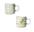 Set de dos tazas de café Brandani con motivos de calabaza y hoja de roble, sobre fondo blanco.