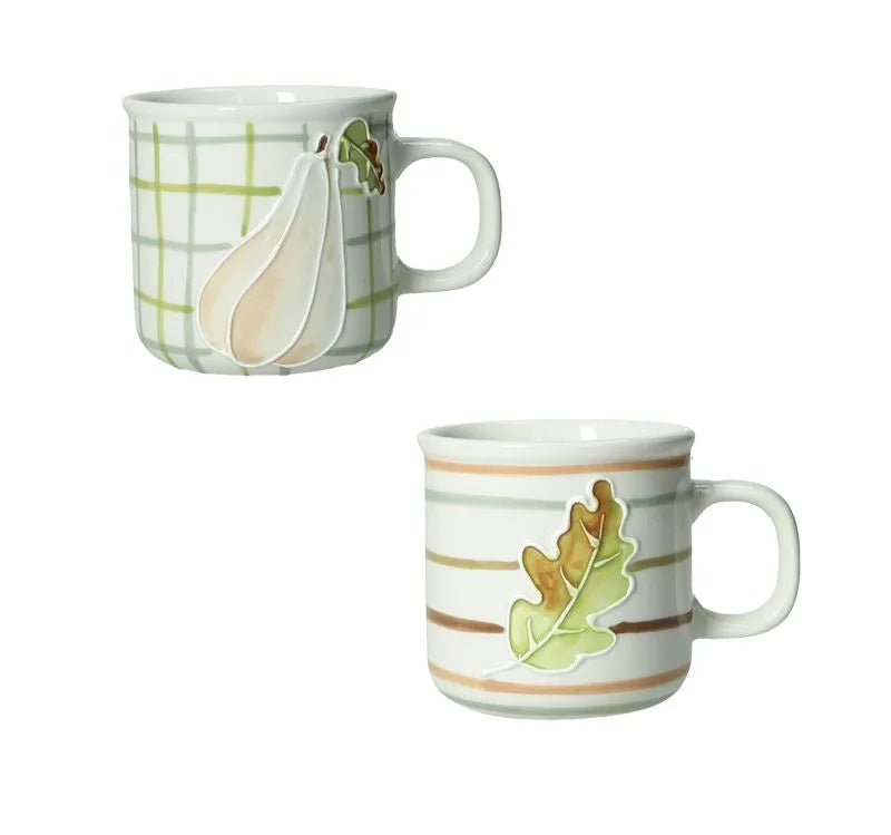Set de dos tazas de café Brandani con motivos de calabaza y hoja de roble, sobre fondo blanco.