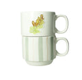 Set de 2 tazas apilables con diseño de hojas y rayas en tonos suaves.