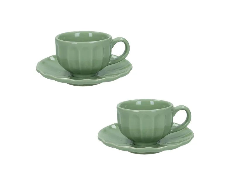 Packshot de un set de dos tazas de café modelo Calipso en color verde, con un diseño moderno y elegante.