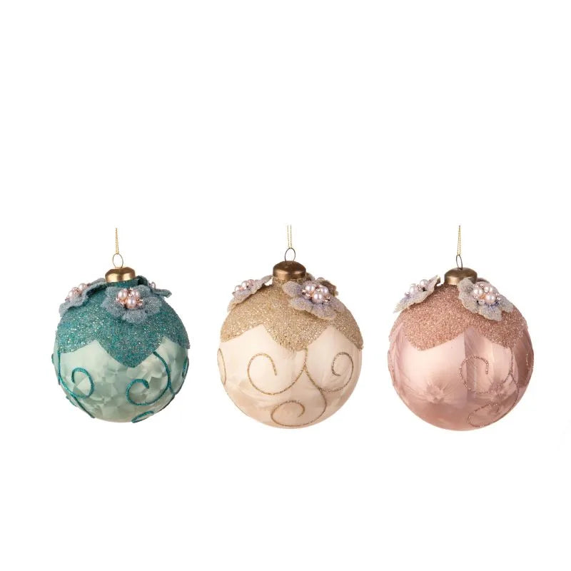 Set de 3 bolas de Navidad de 10 cm, cada una con un diseño festivo.