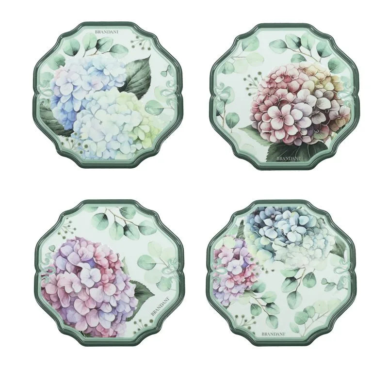 Set de 4 salvavasos Flora de cerámica con estampado floral, presentado sobre fondo blanco.